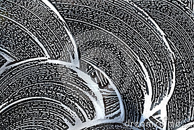 Abstract background. Swirling soap sud foam pattern on window with dark background. Stock Photo