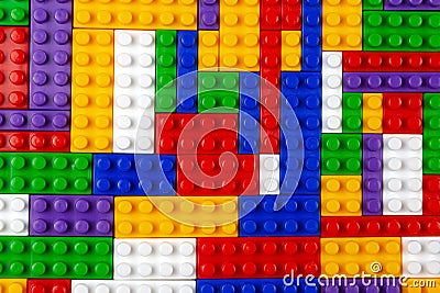 Abstract background texture of colored constructor blocks. Background of colorful plastic part of constructor. Pile of colored toy Stock Photo