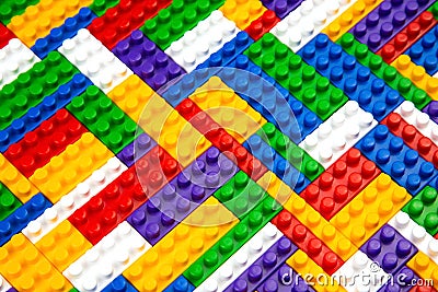 Abstract background texture of colored constructor blocks. Background of colorful plastic part of constructor. Pile of colored toy Stock Photo