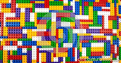 Abstract background texture of colored constructor blocks. Background of colorful plastic part of constructor. Pile of colored toy Stock Photo