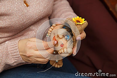 Abstract background, the theme of home hobbies and needlework. Embroidery of toys from foam rubber and womens tights Stock Photo