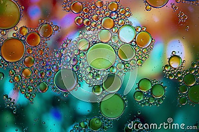 Abstract background with vibrant colours. Oil drops in water. Close colorful and artistic bubbles. Space pattern Stock Photo