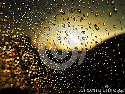 Drops of water on the car glass Driving on the road in the rain Stock Photo