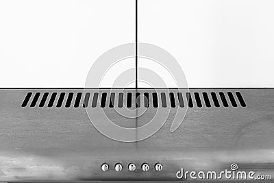 Abstract metallic kitchen exhaust hood with white cupboard Stock Photo