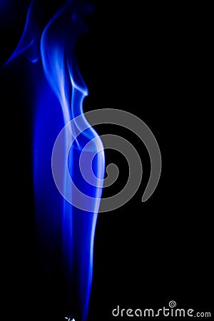 Abstract blue smoke swirls over black background Stock Photo