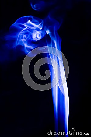 Abstract blue smoke swirls over black background Stock Photo