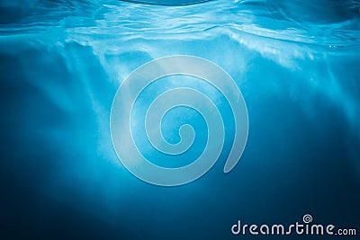 Abstract blue water background with sunbeams Stock Photo