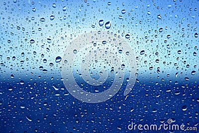 Abstract blue water dropsoin glass background Stock Photo