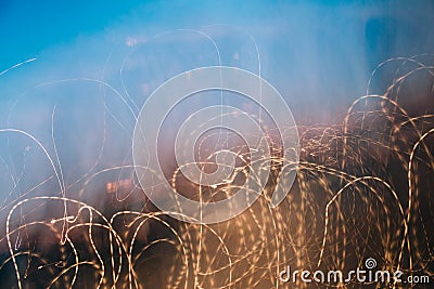 Abstract blured brown and blue photo with chaotic thin lines. Stock Photo