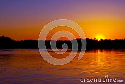 Abstract blurred background with summer lake landscape with golden sunrise. River landscape. Beautiful blur bokeh lights landscape Stock Photo