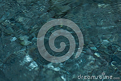 Abstract blurred background - the surface of a transparent clean reservoir with circles from drops Stock Photo