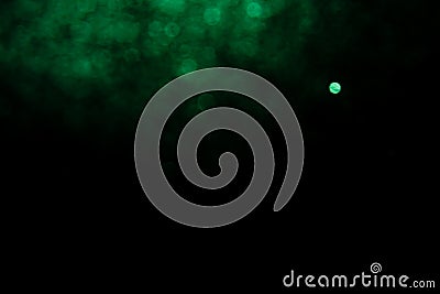 Abstract Blurred image background green bokeh with black background Stock Photo