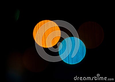 Abstract blurred lights look like planets on the dark background Stock Photo