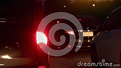 Abstract and blurred rear side of car open light brake at night. Stock Photo