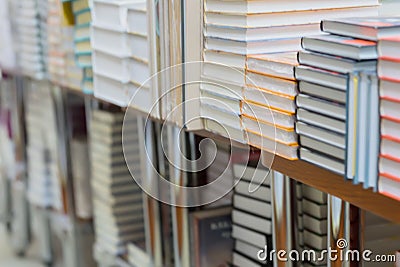 Abstract blurred of stops of books, textbooks or fiction in book store or in library. Education, school, study, reading Stock Photo