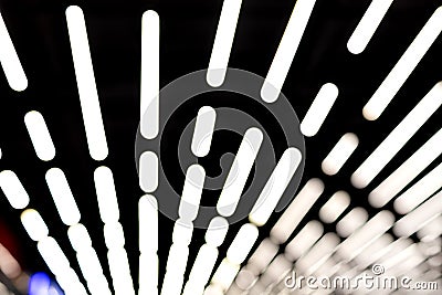 Abstract blurred white neon led light lamp stripes on ceiling. Perspective striped futuristic modern background Stock Photo