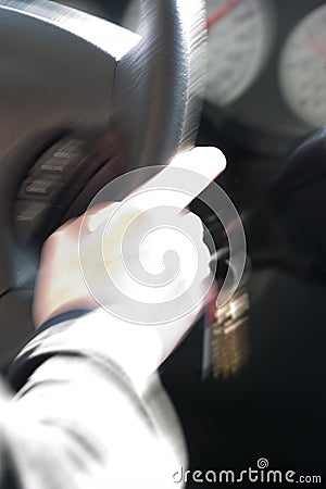 Abstract Blurry Hand on Steering Wheel Stock Photo