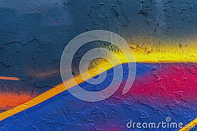 Abstract bright fragment of wall with old chipped paint, scratch, grunge texture. Aerosol design, yellow, blue, pink Stock Photo