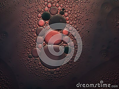 Abstract bubble background in desaturated red and black. Slightly blurred and selective focus. Stock Photo