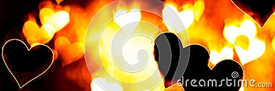 Abstract burning hearts, bright flamy symbol on the black background Stock Photo