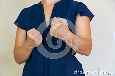 Abstract business woman in blue ready for a fight. Stock Photo