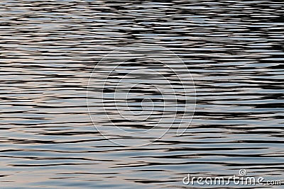 Abstract calm scene of water ripples on surface at dusk, nature detail Stock Photo