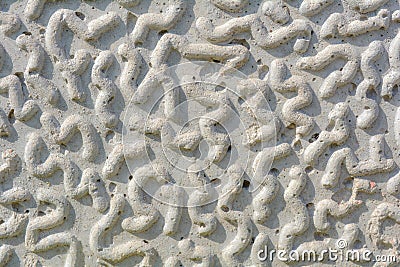 Abstract carved stone texture with worm or caterpillar shape engraved elements Stock Photo