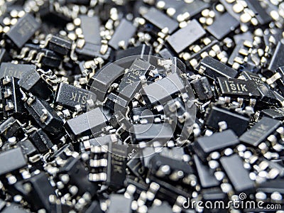 Abstract close-up of scattered surface mount chip computer semiconductor components Stock Photo
