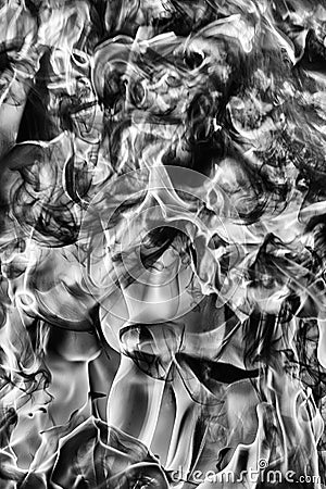 Abstract clouds of natural black smoke and white huge flame of strong fire. Dangerous firestorm abstract texture. Black and white Stock Photo