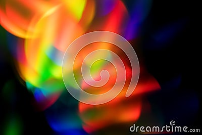 Abstract colorful glowing bokeh rainbow blur background on black Stock Photo