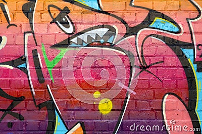 Abstract colorful fragment of graffiti paintings on old brick wall. Street art composition with parts of unwritten letters and Editorial Stock Photo