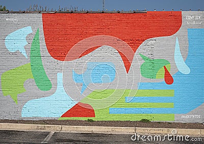 Abstract colorful mural painted on an outside brick wall of a business in the Plaza District, Oklahoma City. Editorial Stock Photo