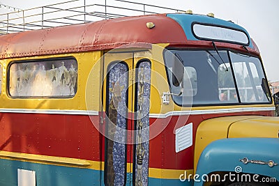 Abstract colorful shape on the metallic wall of an old bus Editorial Stock Photo