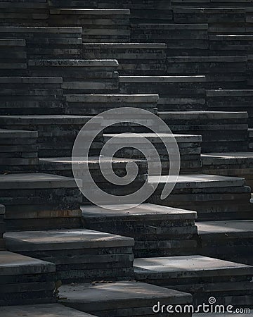Abstract composition of layered, textured dark grey stone slabs creating a sense of depth Stock Photo