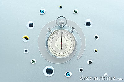 Abstract composition with stopwatch and eyes. Create conceptual with Time, Deadlines, Stress, Aging Stock Photo