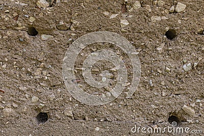 Abstract concrete wall textured background with holes. Stock Photo