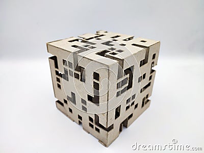 Abstract cube with random square holes pattern made out of cardboard Stock Photo