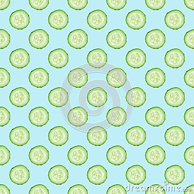 Cucumber slices pattern on sky blue background. Stock Photo