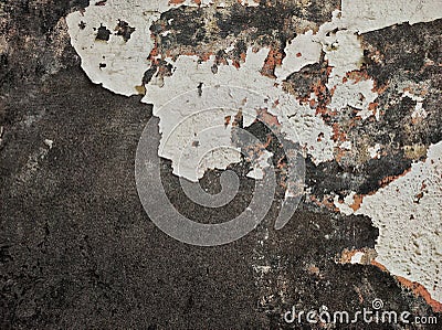 Abstract Dark Grunge wall texture background. Paint cracking off dark wall with rust underneath.distressed crackled texture. Stock Photo