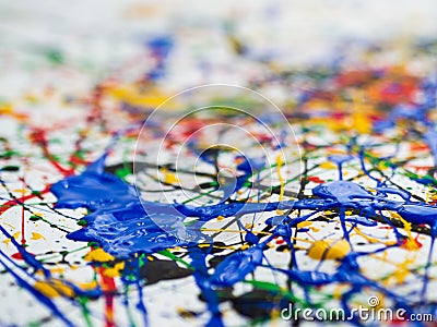 Abstract expressionism art creative background. art of splashes and drips . red black green yellow blue paint on white background Stock Photo