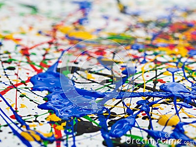 Abstract expressionism art creative background. art of splashes and drips . red black green yellow blue paint on white background Stock Photo