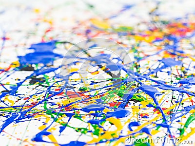 Abstract expressionism art creative background. art of splashes and drips . red black green yellow blue paint on white background Stock Photo