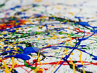 Abstract expressionism art creative background. art of splashes and drips . red black green yellow blue paint on white background Stock Photo