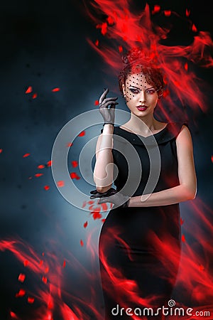 Abstract fashion portrait of young woman with flame Stock Photo