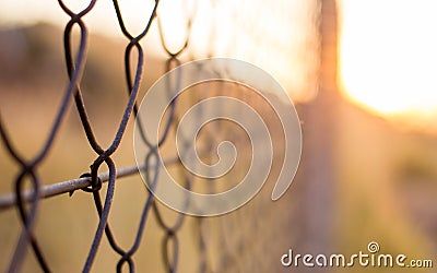 Abstract wired fence in the sunset Stock Photo