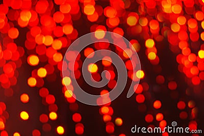 Abstract festive background of red blurry garland lights Stock Photo