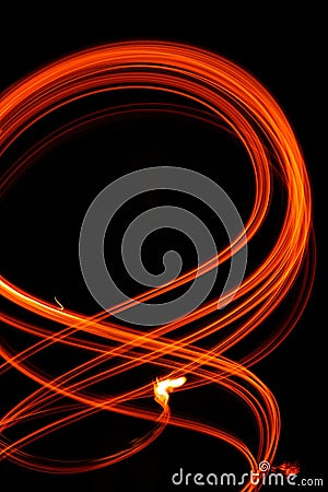 Abstract fiery pattern in the shape of the number 8. Drawing shapes with fire at night, infinity sign, bright colors on night Stock Photo