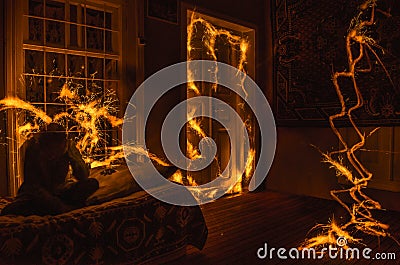 Abstract fireworks flame freezelight on window. Apartment building on Fire at Night time. Fire concept. Azerbaijan Stock Photo