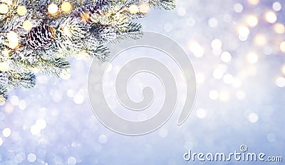 Abstract frosty Christmas lights background with decorated fir tree branch Stock Photo