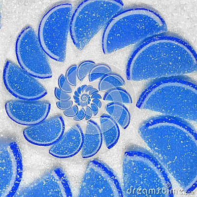 Abstract fruit jelly wedges blue cantle lobule on white sugar background. Blue jellies Abstract fruit jelly on white sugar backgro Stock Photo